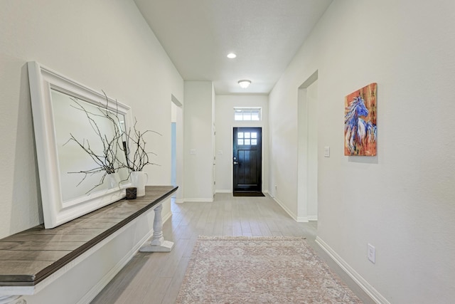 doorway to outside with light hardwood / wood-style flooring