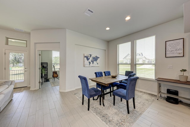 dining space featuring light hardwood / wood-style floors