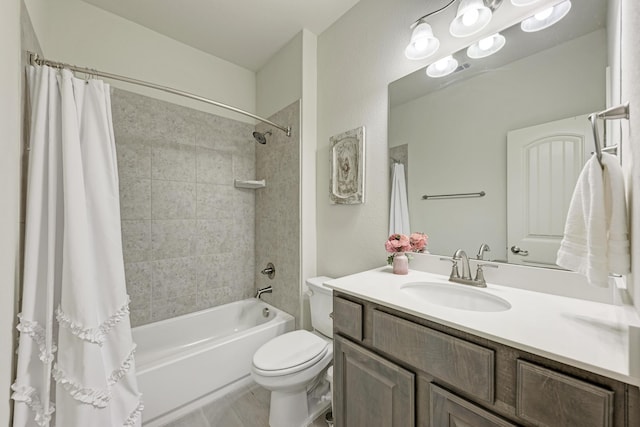 full bathroom with vanity, shower / tub combo, and toilet