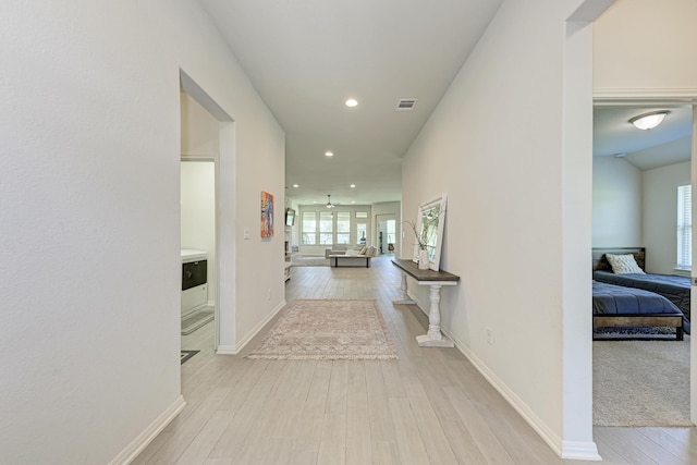 corridor featuring light hardwood / wood-style flooring