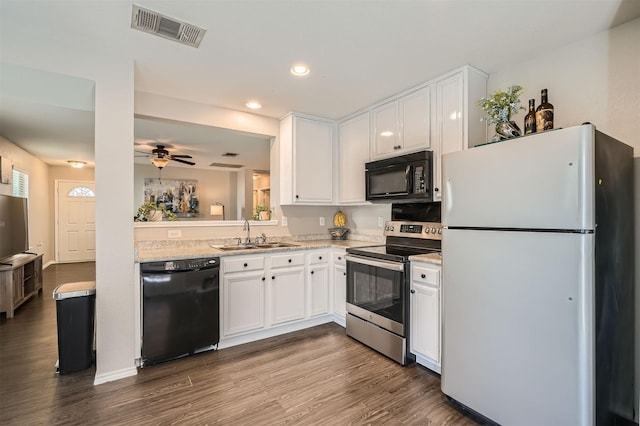 kitchen with sink, white cabinetry, ceiling fan, hardwood / wood-style floors, and black appliances