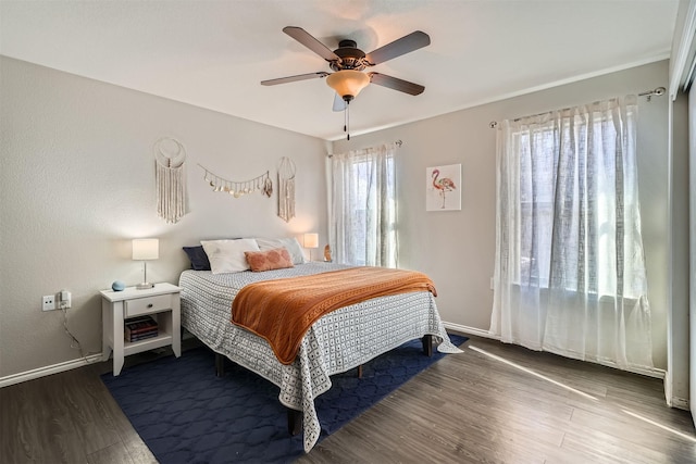 bedroom featuring hardwood / wood-style flooring and ceiling fan