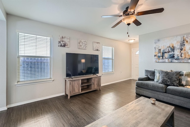 living room with dark hardwood / wood-style floors and ceiling fan