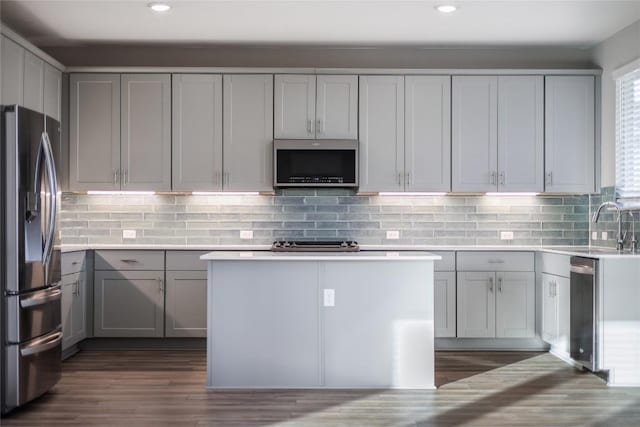 7001 Lewiston Way, Austin, TX 78724 - kitchen featuring stainless steel appliances, gray cabinets, recessed lighting, dark wood finished floors, and light countertops