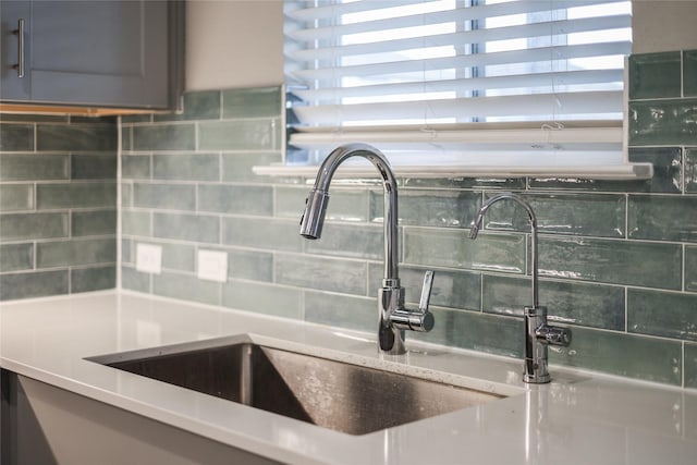 room details with sink and decorative backsplash