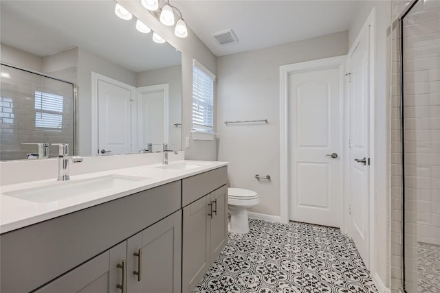 7001 Lewiston Way, Austin, TX 78724 - bathroom featuring double vanity and a shower stall