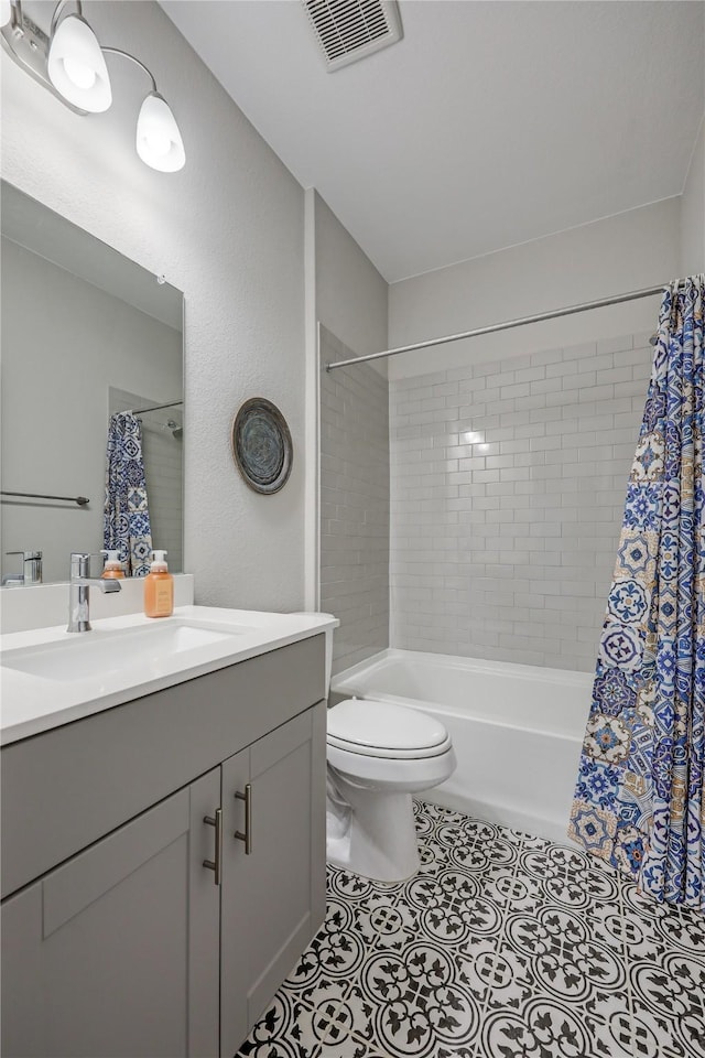 full bathroom featuring shower / bath combination with curtain, vanity, toilet, and tile patterned flooring