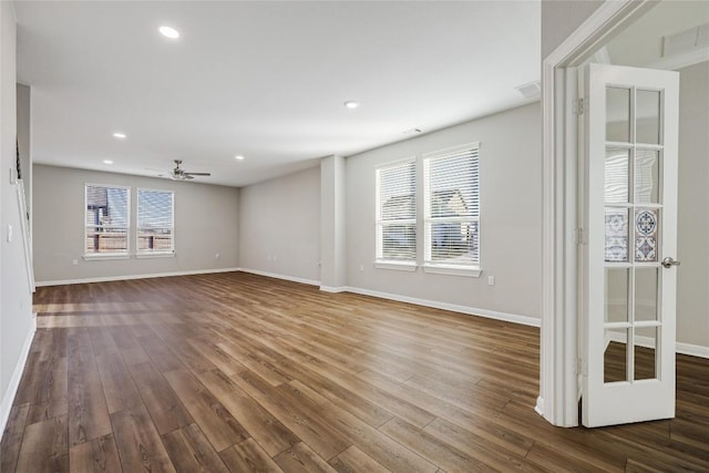 7001 Lewiston Way, Austin, TX 78724 - spare room with dark wood-style flooring, a ceiling fan, and recessed lighting