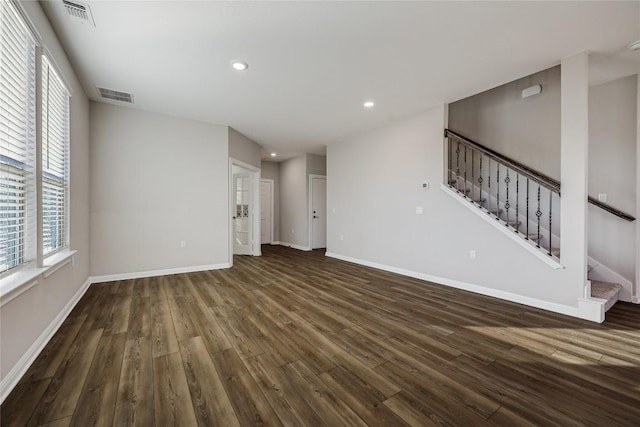 7001 Lewiston Way, Austin, TX 78724 - unfurnished living room featuring wood finished floors, stairway, and recessed lighting