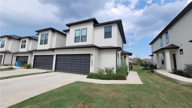 view of front of property with a garage and a front yard