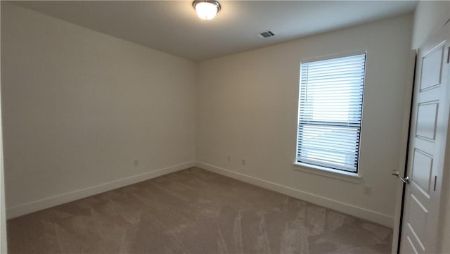 spare room featuring carpet floors