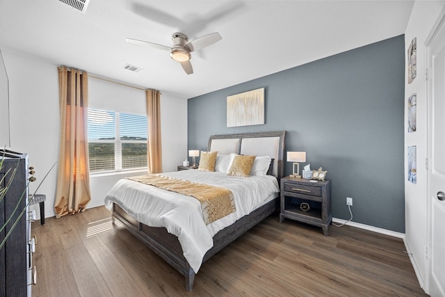 bedroom with dark wood-type flooring and ceiling fan