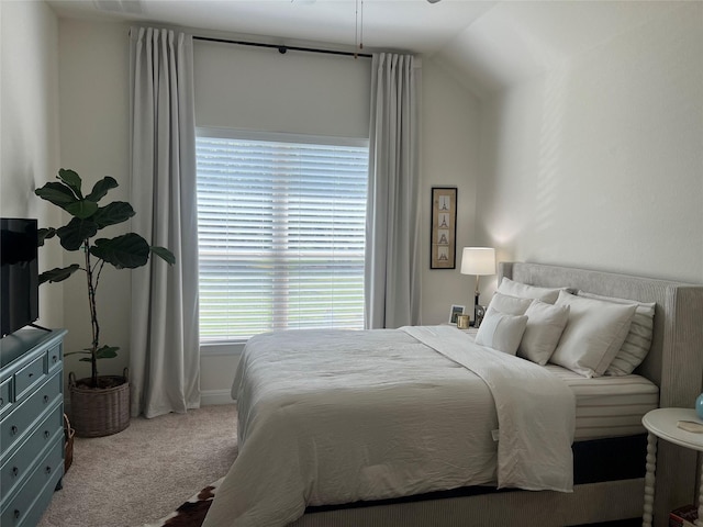 carpeted bedroom featuring vaulted ceiling