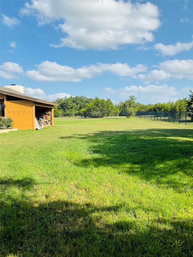 view of yard with a rural view