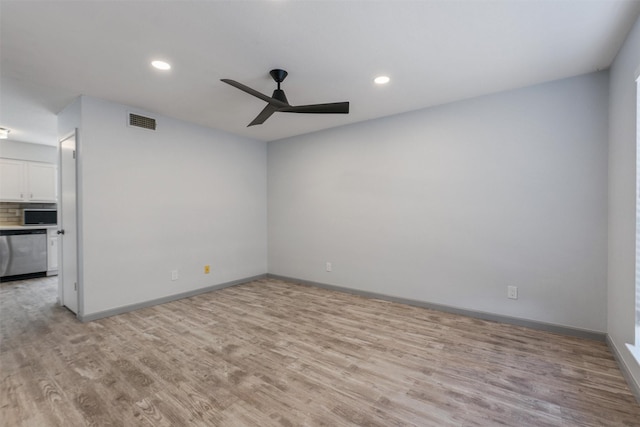 unfurnished room featuring light hardwood / wood-style floors and ceiling fan