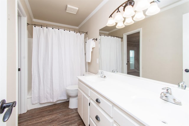 full bathroom with crown molding, hardwood / wood-style flooring, vanity, toilet, and shower / bath combo with shower curtain