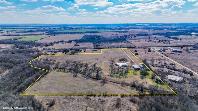 birds eye view of property featuring a rural view