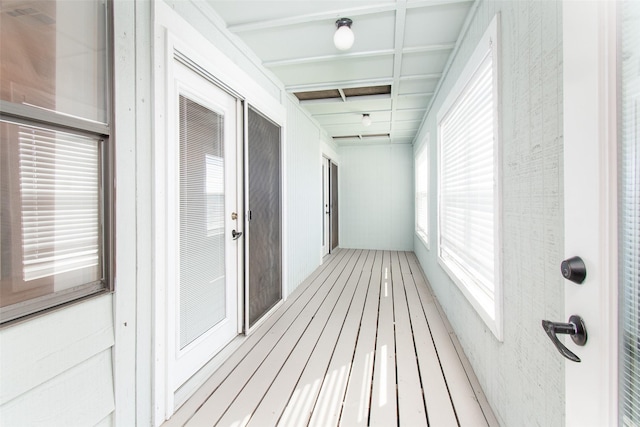 corridor featuring hardwood / wood-style floors