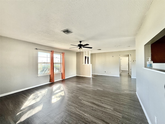 unfurnished room featuring dark hardwood / wood-style flooring, a textured ceiling, and ceiling fan