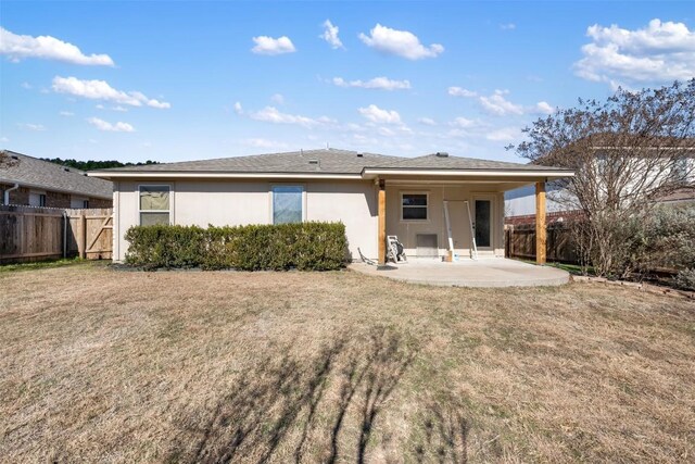 1016 Flanagan Dr, Leander, TX 78641 - back of house with a patio and stucco siding