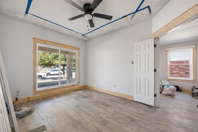 1016 Flanagan Dr, Leander, TX 78641 - spare room with wood finished floors and ceiling fan