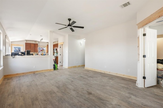 1016 Flanagan Dr, Leander, TX 78641 - unfurnished living room featuring wood finished floors, a ceiling fan, and lofted ceiling