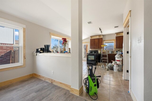 1016 Flanagan Dr, Leander, TX 78641 - hall featuring healthy amount of natural light and light tile patterned floors