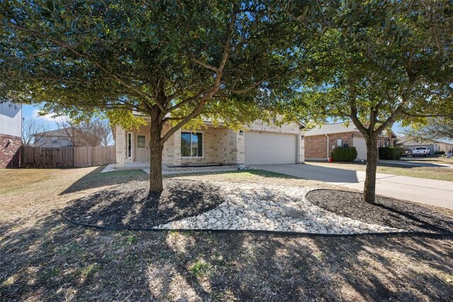 1016 Flanagan Dr, Leander, TX 78641 - view of front of property with concrete driveway and an attached garage