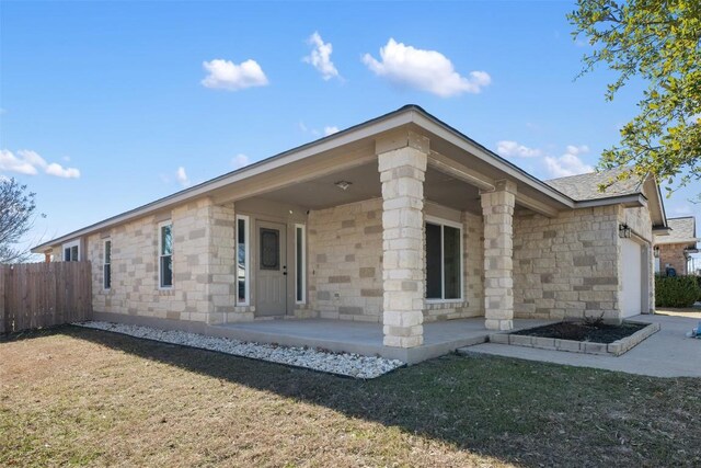 1016 Flanagan Dr, Leander, TX 78641 - rear view of property featuring an attached garage