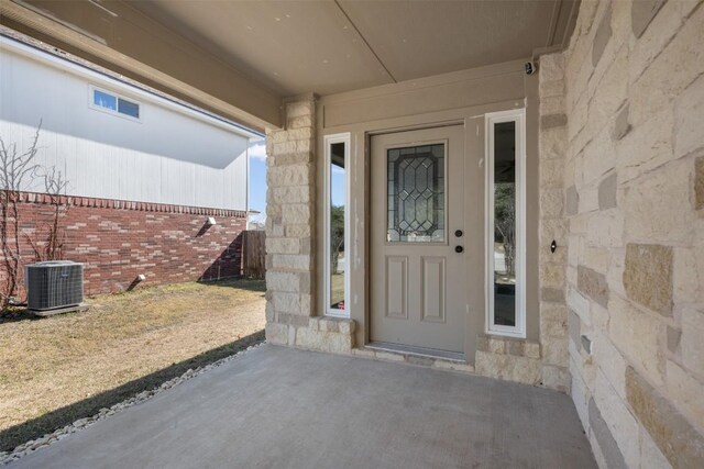 1016 Flanagan Dr, Leander, TX 78641 - doorway to property with stone siding and a patio