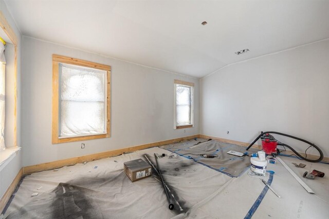 1016 Flanagan Dr, Leander, TX 78641 - unfurnished room with lofted ceiling and baseboards