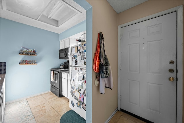 entryway featuring light tile patterned floors