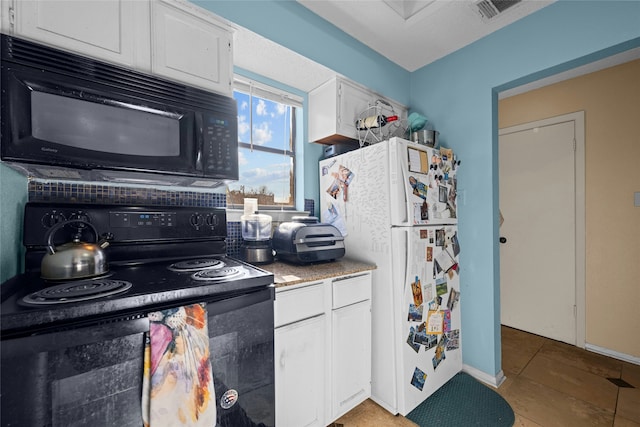 kitchen with light tile patterned floors, black appliances, and white cabinets