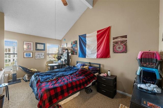 carpeted bedroom with multiple windows, vaulted ceiling with beams, and ceiling fan