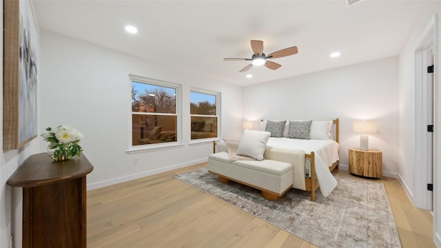 bedroom featuring ceiling fan and light hardwood / wood-style floors