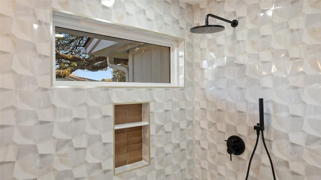 interior details featuring a tile shower