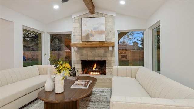 living room featuring hardwood / wood-style flooring, a fireplace, and lofted ceiling with beams