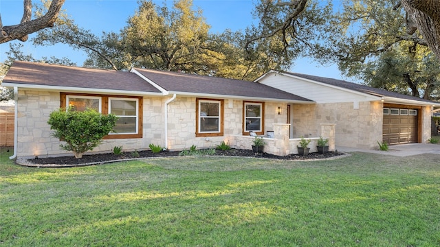 ranch-style home featuring a garage and a front lawn