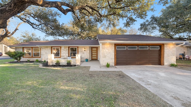 single story home featuring a garage and a front yard