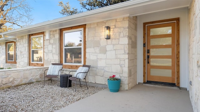 doorway to property featuring a patio