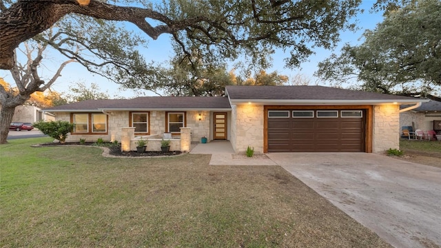 ranch-style house with a garage and a front lawn