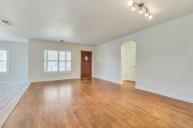 unfurnished living room featuring light hardwood / wood-style floors