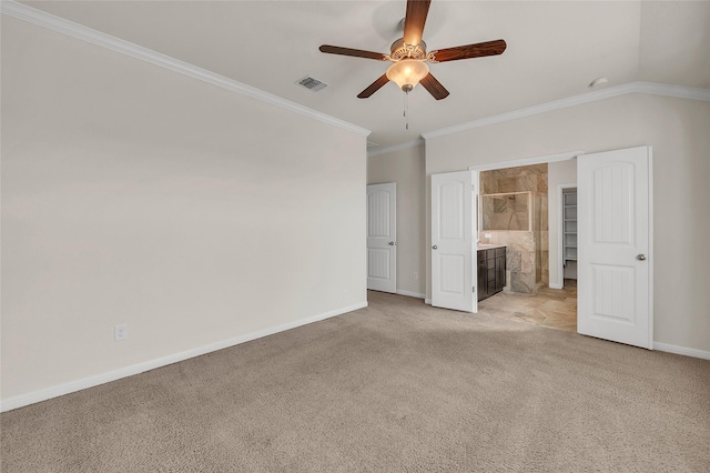 unfurnished bedroom with ceiling fan, ornamental molding, connected bathroom, and light colored carpet