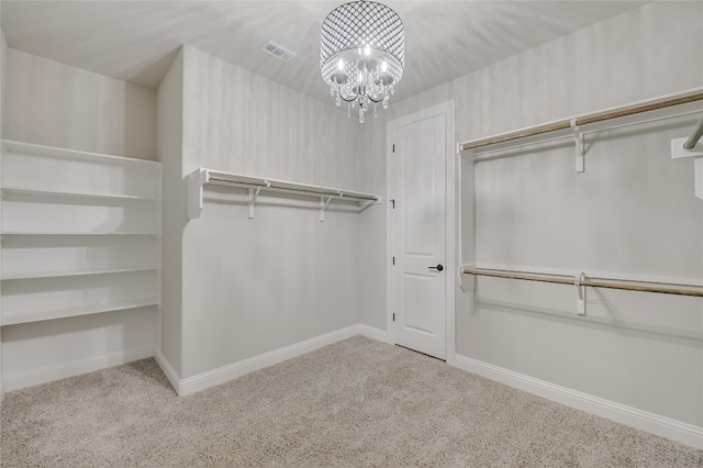 125 Serene Hilltop Cir, Austin, TX 78738 - walk in closet with carpet floors and a chandelier