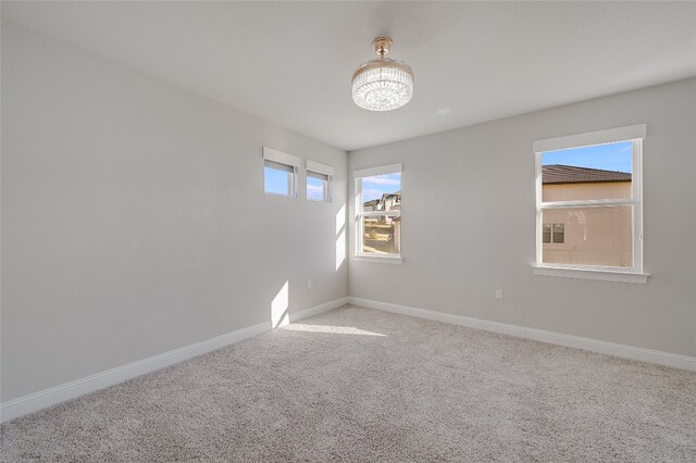 125 Serene Hilltop Cir, Austin, TX 78738 - spare room featuring light colored carpet and baseboards