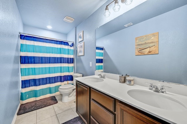 bathroom with vanity, tile patterned flooring, a shower with curtain, and toilet