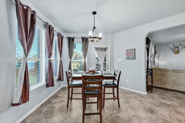 dining area featuring a chandelier