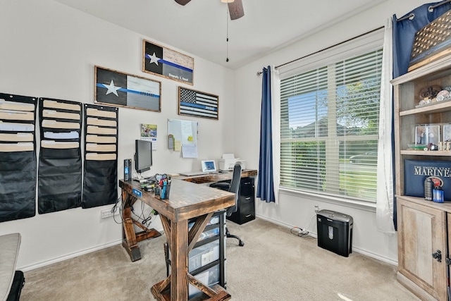 carpeted home office featuring a healthy amount of sunlight and ceiling fan