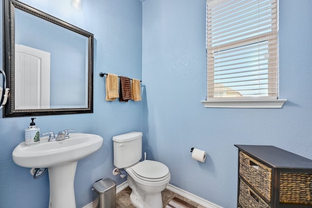 1712 Uhland Dr, Leander, TX 78641 - half bathroom featuring toilet and baseboards