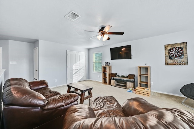 living room featuring light colored carpet and ceiling fan